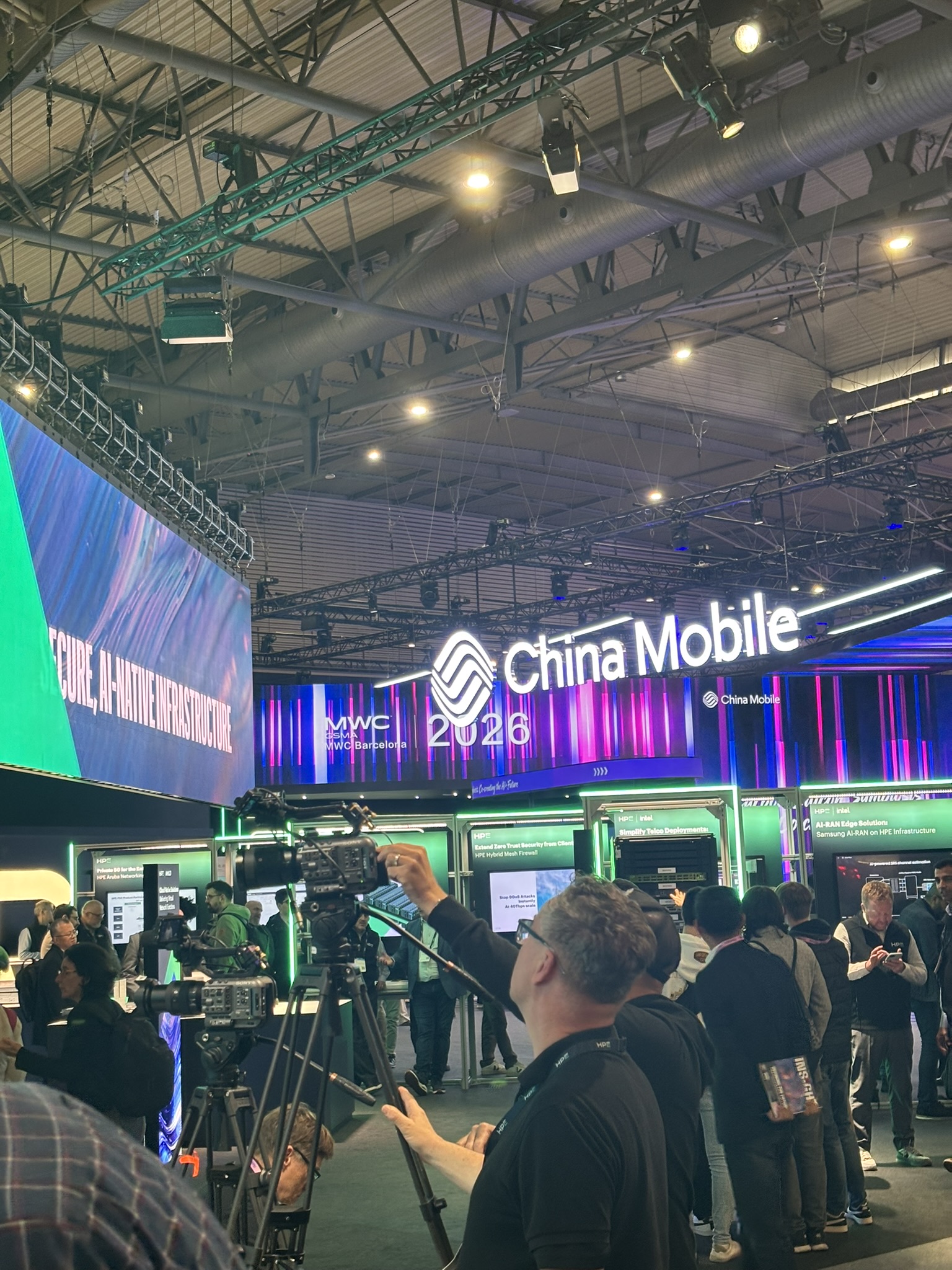 Crowded hall at MWC Barcelona with a China Mobile booth in March 2026